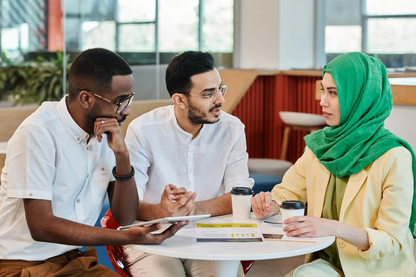 An advisor talking with a client over documents